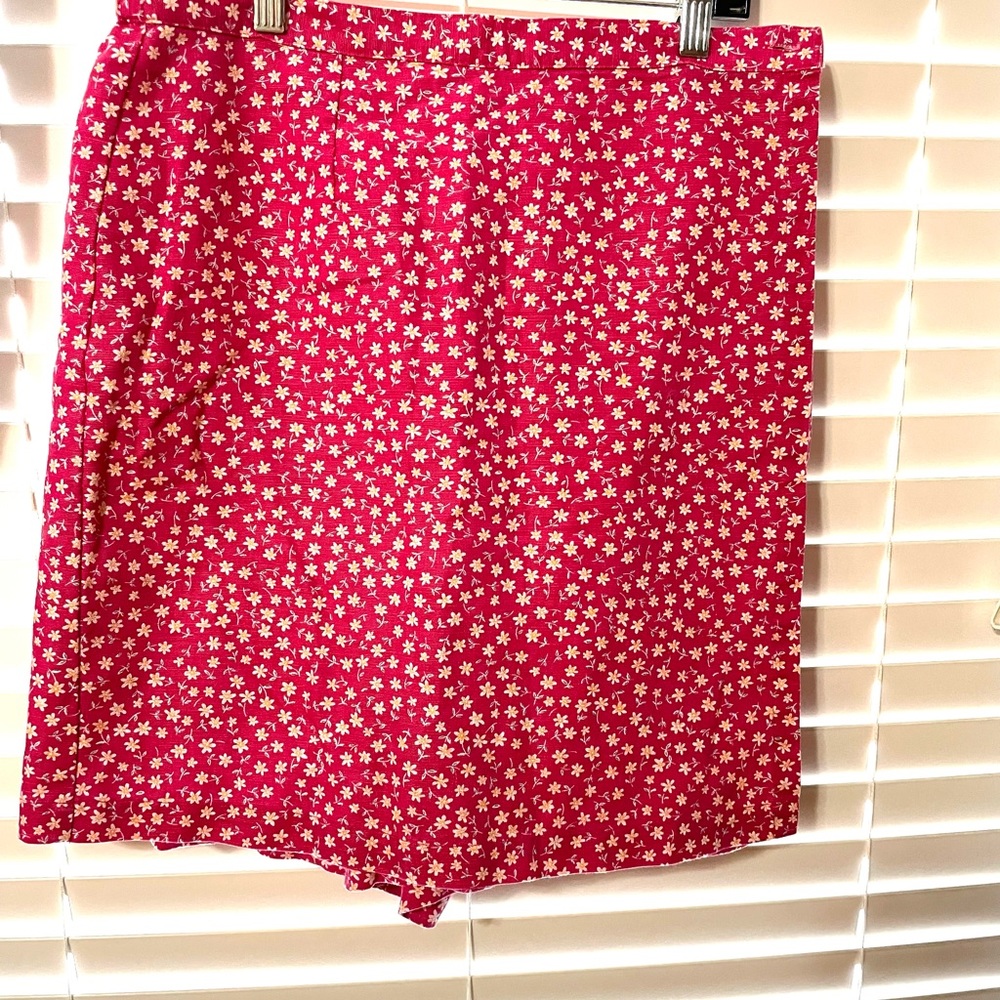 Pink skort with daisy pattern.
